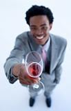Afro-American businessman celebrating a success with wine