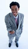 Afro-American businessman holding a mobile phone