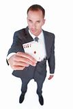 High angle of a businessman holding aces