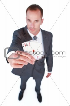 High angle of a businessman holding aces