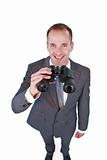 High angle of a businessman holding binoculars