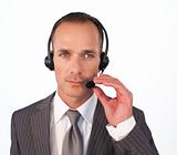 Serious businessman with a headset on 