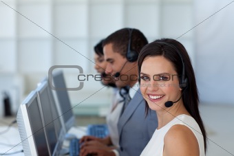 Smiling businesswoman in a call canter 