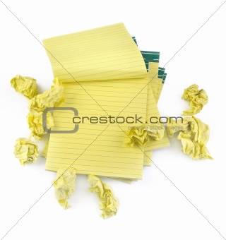 lined paper notebooks and crumpled paper