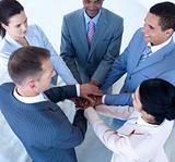 Multi-ethnic business team with hands together