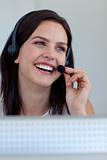 Smiling businesswoman in a call centre