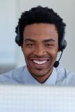 Portrait of a smiling Afro-American businessman in a call center