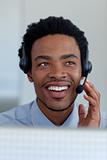 Afro-American businessman in a call center