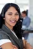 Confident ethnic businesswoman in a call center