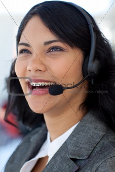 Smiling businesswoman in a call center
