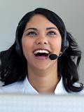 Smiling businesswoman talking in a call center