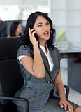 Businesswoman on mobile phone in office