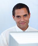 Attractive businessman working with a computer