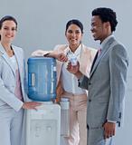 Business people with a water cooler in office