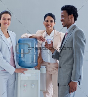 Business people with a water cooler in office