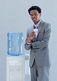 Businessman with a water cooler in office