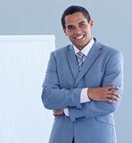 Smiling young businessman giving a presentation