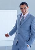 Young businessman pointing at a whiteboard