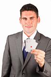 Businessman holding aces poker cards