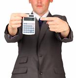 Businessman holding a calculator