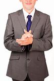 Isolated businessman clapping against white background