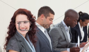 Smiling businesswoman talking in a meeting