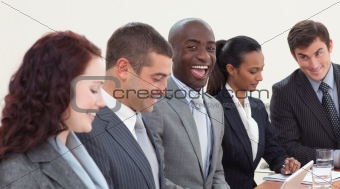 Happy businessman working in a meeting