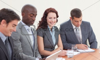 Smiling businesswoman working in a meeting