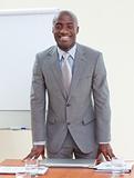 Attractive Afro-American businessman in office