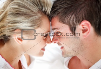 Close-up of smiling couple looking at each other