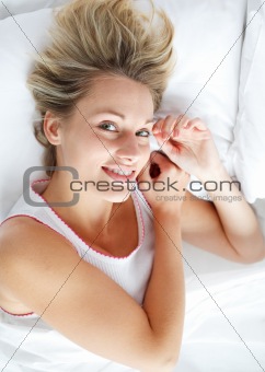 Beautiful woman lying in bed