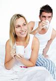 Couple drinking coffee in bed