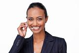 Smiling Indian businesswoman talking on a headset