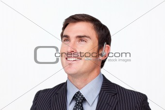 Portrait of a  businessman with a headset on isolated in white