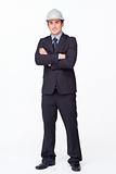 Standing attractive businessman with folded arms