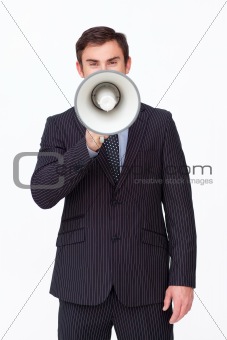 Young businessman shouting through a megaphone