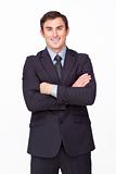 Confident businessman with folded arms smiling