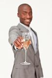 Ethnic businessman celebrating a success with champagne