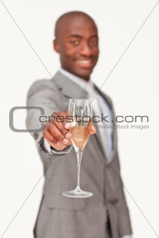 Ethnic businessman celebrating a success with champagne