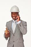 Attractive ethnic architect on phone holding plans