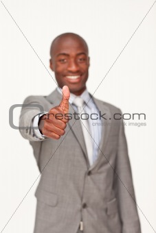 Ethnic businessman with thumbs up