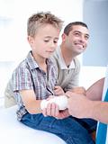 Bandaging an arm injury on a child