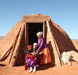 2 Navajo Women Outside Their Traditional Hogan Hut