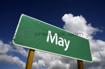 May Green Road Sign with dramatic blue sky and clouds - Months of the Year Series.