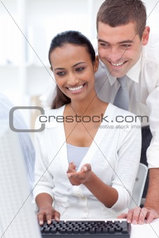 Businessman and businesswoman using a computer