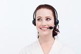 Beautiful businesswoman with a headset on looking upwards
