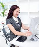 Young businesswoman getting frustrated with a computer