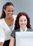 Beautiful businesswomen using a computer