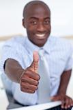 High angle of a businessman in office with thumb up