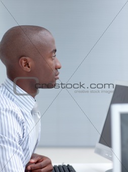 Businessman working in office with a computer